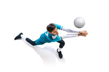 Portrait of young man, volleyball player in motion, training, playing isolated over white studio...