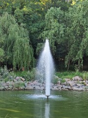 fountain running in a recreation park in Ukraine, cityscape