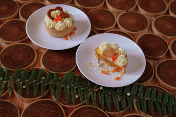 Cake. there are two plates of cake on the table. meal. sweet food
