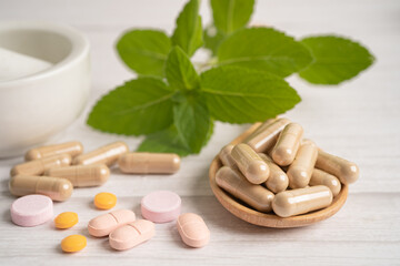 Alternative medicine herbal organic capsule with vitamin E omega 3 fish oil, mineral, drug with herbs leaf natural supplements for healthy good life.