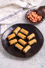 Pistachio baklava. Baklava filled with pistachio on a stone floor. Turkish cuisine desserts. close up