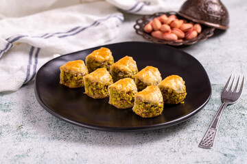 Pistachio baklava. Baklava filled with pistachio on a stone floor. Turkish cuisine desserts. close up