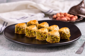 Pistachio baklava. Baklava filled with pistachio on a stone floor. Turkish cuisine desserts. close up