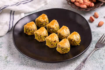 Pistachio baklava. Baklava filled with pistachio on a stone floor. Turkish cuisine desserts. close up