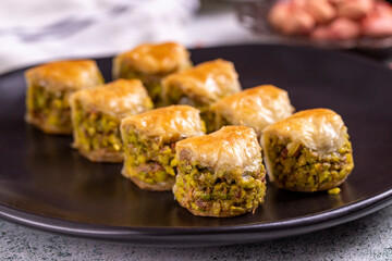 Pistachio baklava. Baklava filled with pistachio on a stone floor. Turkish cuisine desserts. close up