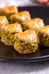 Pistachio baklava. Baklava filled with pistachio on a stone floor. Turkish cuisine desserts. close up