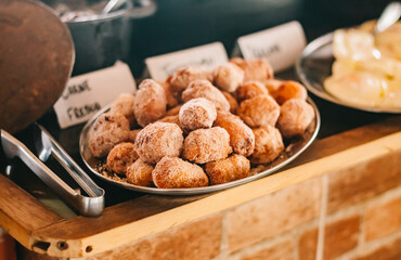 Banana dumplings with breaded sugar without on a platter