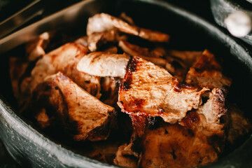 Fried pork chops served with feijoada in restaurant