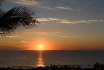 Gordijnen Beautiful, tropical sunset at La Reunion, sun over the sea with orange sky © brunok1