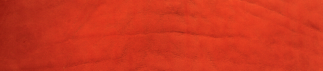 Background of red natural leather texture. Panoramic banner