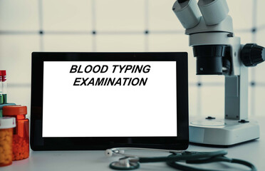 Medical tests and diagnostic procedures concept. Text on display in lab Blood Typing Examination - obrazy, fototapety, plakaty