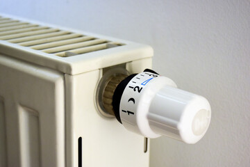 radiator temperature adjusment dial or knob in closeup view. heating conrol and natural gas usage...