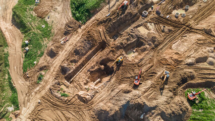 Aerial view of excavators on earthwork at construction site. Earthworks during the install of storm...