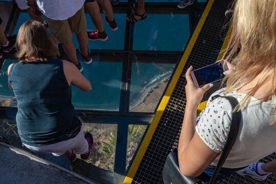 people standing on a glass skywalk in Madeira 