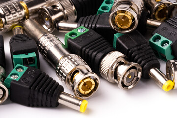 Various connectors for coaxial and twisted pair cable, for video signal transmission.
