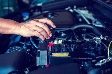 Check and maintenance the battery in car with yourself. Service and maintenance car.