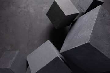 Concrete cube shape on floor background texture. Cement block as construction concept