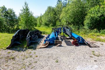 Disassembled snow plow blade outside the winter season