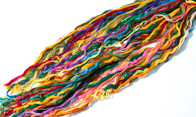 multi-colored threads for embroidery, floss, Mixed colorful texture of interlaced threads