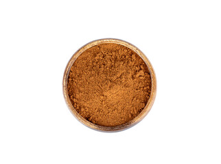 Top view of a wooden bowl full of ground red pepper on a white background.