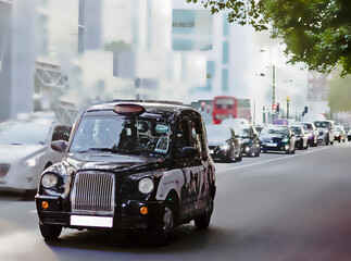 photograph of an English cab-type taxi, which is one of the recognizable pictures of London - obrazy, fototapety, plakaty