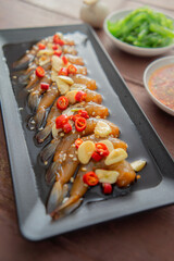 Prawns pickled in soy sauce or shoyu sauce and sprinkled with chili and sliced garlic with spicy...