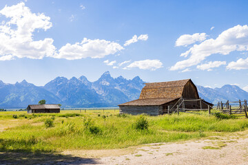 Sunny view of the John Moulton Barn and Teton Range
