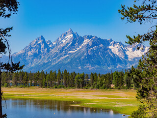 Sunny view of the Teton mountain range of Grand Teton National Park