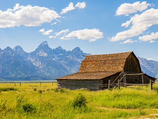 Obraz premium Sunny view of the John Moulton Barn and Teton Range