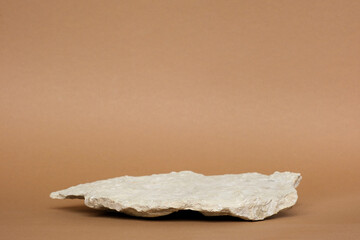 Stone Podium for promotion on beige Background. Natural pedestal. Two stone podiums. Beauty product mockup. Scene to show products. Showcase, display case. Front View, soft shadow