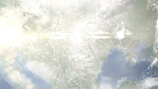 Earth zoom in from outer space to city. Zooming on Bistrita, Romania. The animation continues by zoom out through clouds and atmosphere into space. Images from NASA