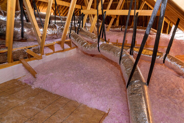 Eco wool insulation is poured in the attic insulation roof for new home - obrazy, fototapety, plakaty
