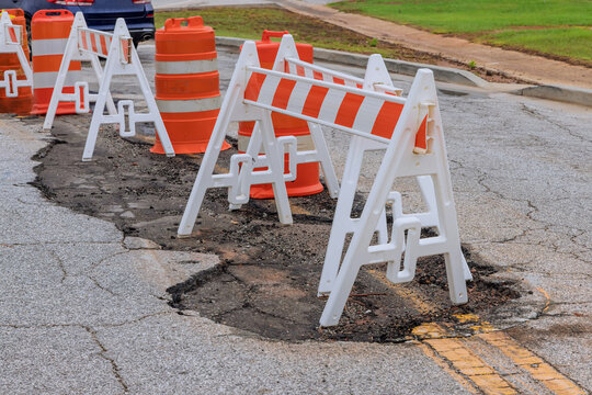 Road potholes damaged in the pavement need to be repaired with a carriageway bypassing the area