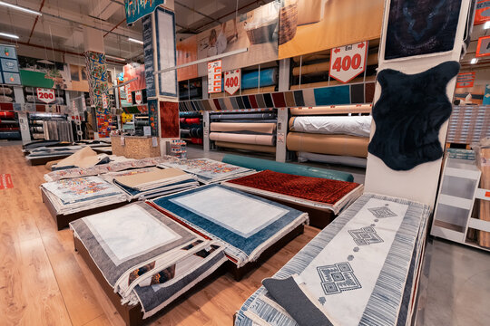 27 June 2022, Antalya, Turkey: Assortment of carpets is sold in a Bauhaus store in the mall. Textile and synthetic materials
