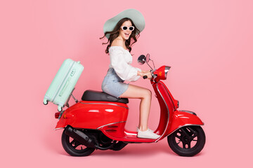 Plakat Full size profile portrait of positive pretty person drive bike weekend rest relax isolated on pink color background
