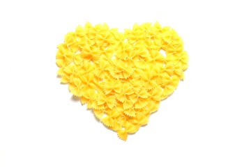 Pasta in the shape of a heart on a white background.