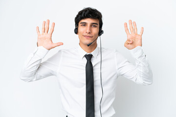 Telemarketer man working with a headset isolated on white background counting nine with fingers