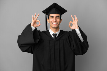 Young Argentinian university graduate isolated on grey background in zen pose