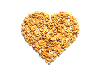 walnut in the shape of a heart on a white background.