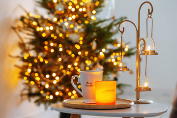 cup with hot drink on background christmas tree