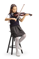 Full length shot of a schoolgirl sitting on a chair and playing a violin © Ljupco Smokovski