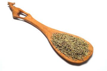 Closeup of dried rosemary on a wooden spoon isolated over white background.
