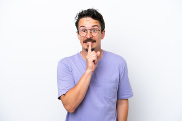 Young man with moustache isolated on white background showing a sign of silence gesture putting...