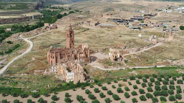 a view of the remains of the old town of Belchite, Zaragoza Spain, destroyed during the Spanish Civil War and abandoned from then, highlighting the San Martin de Tours church, Front view