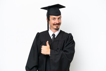 Young university graduate man isolated on white background giving a thumbs up gesture