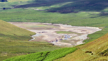 Part of Craig Goch Reservoir, Elan Valley,Wales, UK,during drought July 2022,