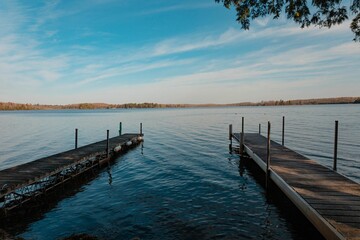 Beautiful shot of two wooden piers at the lakeshore