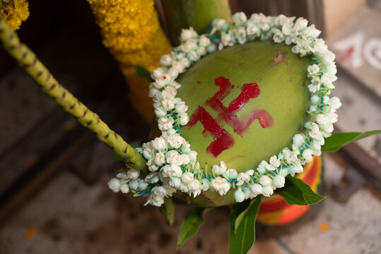 copper kalash with coconut and mango leaf with floral decoration