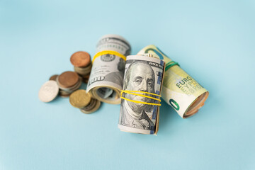 International money dollar bills, coins lie next to money twisted rubber bands. Place for an inscription.