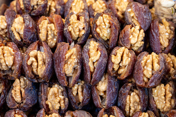 Turkish or arabic sweet dessert, ripe dried dadels with walnuts sweetened with syrup or honey.